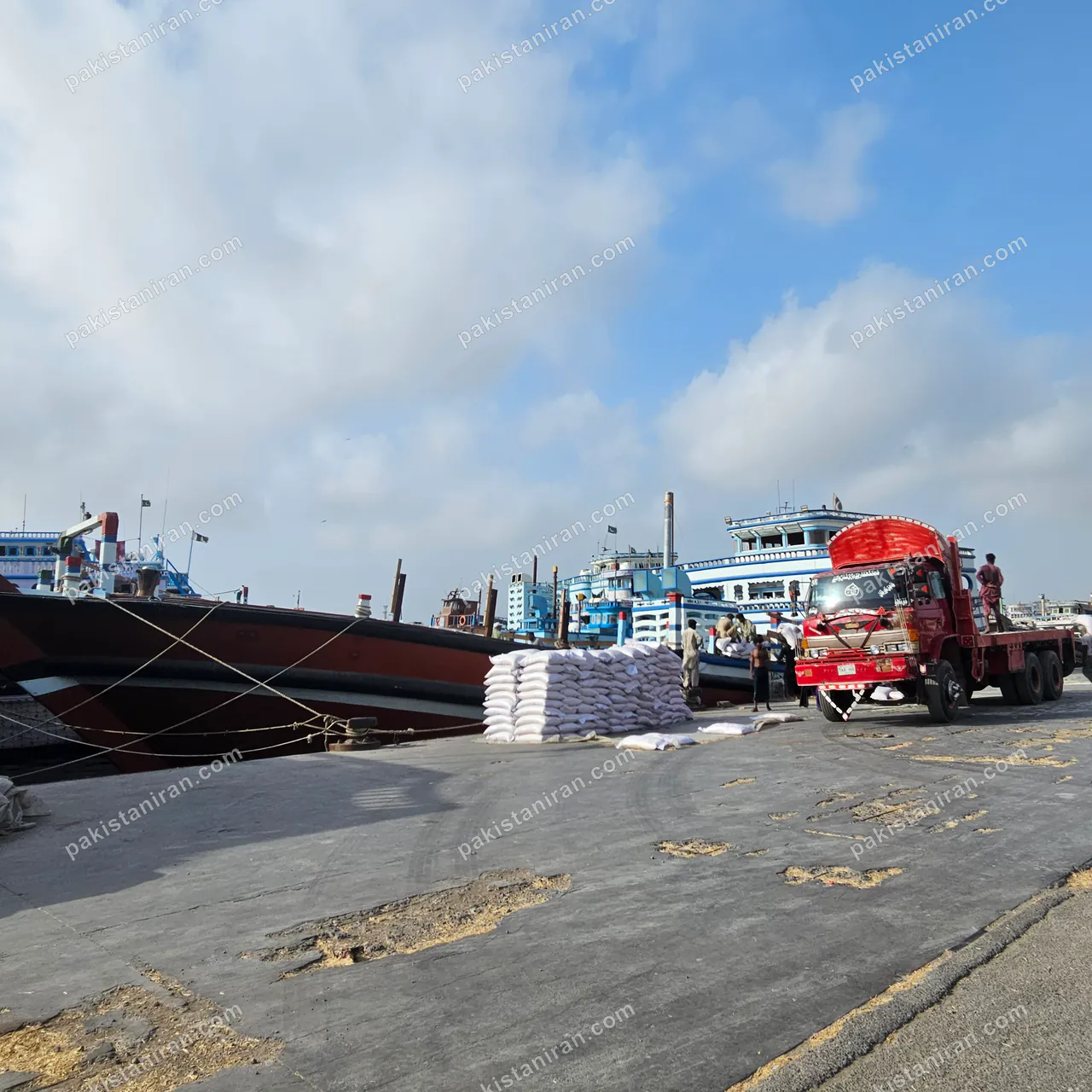 HAS Trading shipment: Loaded launch at the quay, rice stacked for the crossing